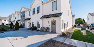 AWESOME END UNIT with attached 2 stall garage and additional personal parking spot on the exterior Gallery 1