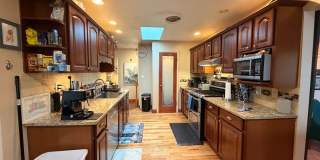 Quiet Ranch Retreat Steps from Light Rail with Finished Basement & Designer Kitchen Gallery 6