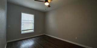 RESERVE AT WEDGEFIELD 3 bedroom 2 bath home with stainless appliances, laminate flooring and a fenced back  yard! Gallery 28