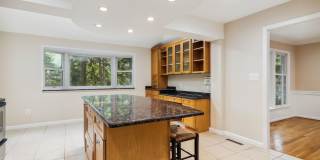 5 BR 4.5 BA home with inground heated pool and extensive hardscape! Gallery 10