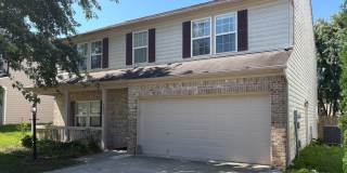 Fully Furnished 4-Bedroom Home with a Stocked Kitchen, Fenced Yard, and 2-Car Garage Gallery 1
