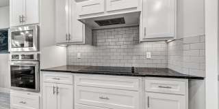 Modern 3-Bedroom Bella Vista Home with Bonus Room and Tiered Deck Gallery 7