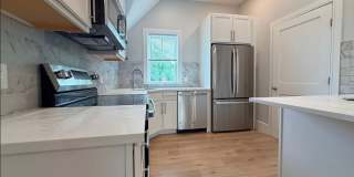 Brand New Construction in Perfect Location!  Laundry in Unit, Centralized Heating and A/C!  Pro Managed! Gallery 1