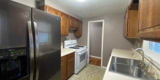 {7047} Prairie Village Ranch with Hardwood Floors + Large, Fenced Yard + 1 Car Garage Gallery 10