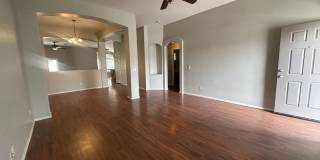 Single-level 3-bedroom home in a desirable Chandler location featuring a 2-car garage and tile roof and wood plank flooring throughout Gallery 8