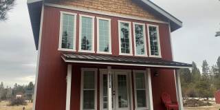 Charming Canal-Front Cottage Near Sunriver | Month-to-Month Gallery 1