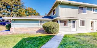 Lovely Two Bedroom One Bath Two Story Condo with Carport & Laundry Facility Gallery 1