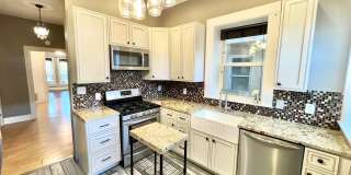 NEW LOW PRICE and Move in Special - Charming 2 bed 1 bath W/D in unit, free parking, renovated kitchen, fenced backyard, in a walkable area! NEW LOW PRICE and Move in Special - Charming 2 bed 1 bath W/D in unit, free parking, renovated kitchen, fenced backyard, in a walkable area! Gallery 1