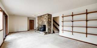 Welcome home! One of a kind, strikingly designed 2-level hillside chalet built on 1 1/2 acres of wooded property with stream surrounded by park land. Gallery 26