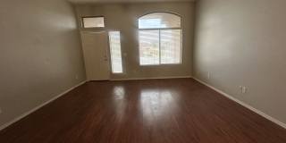 Single-level 3-bedroom home in a desirable Chandler location featuring a 2-car garage and tile roof and wood plank flooring throughout Gallery 11