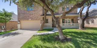 Spacious & Bright Home with Mature Trees, Covered Patio, Fireplace, Private Backyard & Resort-Style Amenities- Pool, Splash Pad, Trails & Lake Access Gallery 1