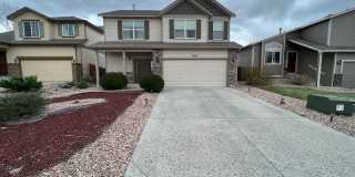Well Appointed Former Model Home on Constitution and Powers! Gallery 1