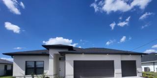Brand-New Luxury Home with 3-Car Garage & Lawn Care Included | Modern Living in Cape Coral! Gallery 1