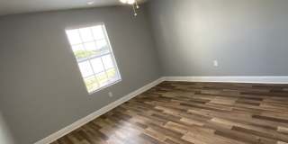 1/1 in the Heart of Brandon with a lake view! Gallery 5