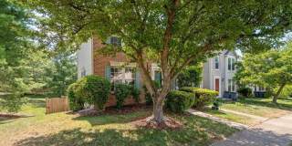 Amazing, updated end unit townhome backing to trees and open common area in Centre Ridge neighborhood! Gallery 1