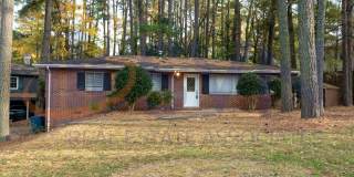 Charming Brick Ranch on a Spacious, Wooded Lot! Gallery 1
