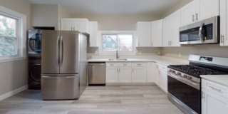 Renovated 6BR with In-Unit Laundry, 3 Parking Spaces & Commuter Rail Access Gallery 1