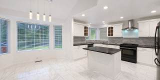 Executive 3 Bed Home with 3 Car Garage  Private Fenced Yard Gallery 1