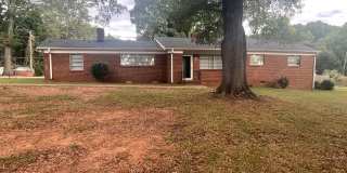 This Beautiful 4 bed 2.5 bath brick ranch home sits on 0.68 acres of land in the desired Steelberry community Gallery 1