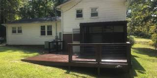 Travelers Rest !! 3 BR, 2 BA with Great Living Space - Den, Bonus Room, Primary Suite has a HUGE walk in Closet, Laundry Room, private screened in porch & deck AND a storage shed out back.  Fresh Paint and New LVP Floors Gallery 25