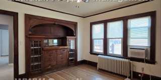 Large main floor duplex unit, Updated Kitchen & Bath, Full Dining Room w/Built-ins + Sunroom, garage stall Gallery 8