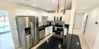 Annual furnished Updated 4-Bedroom Pool Home with Spacious Living Areas Gallery 9