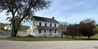 404 W. Springfield Rd.  Farmhouse 4 Bedrooms | 2 Bathrooms | 3,468 Sq. Ft. Gallery 1