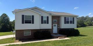 Spacious 3-Bedroom Split-Level Home with Bonus Space & Large Yard Gallery 1