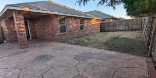 2 car garage with lighting, granite countertops. Backyard includes a custom extended concrete patio perfect for gatherings Gallery 21