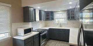 Close to Campus! 4BR Home with Finished Basement, Private Parking & Hardwood Floors Gallery 1