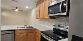 Light & bright and move in ready, updated townhome in Oakwood Villas. Gallery 6