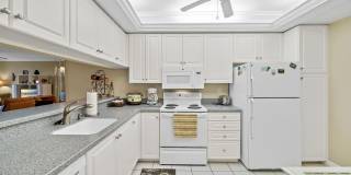 first-floor unit featuring a 2 bedroom, 2 bath fully furnished Gallery 5