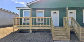 Welcome home to this beautifully designed 3-bedroom, 2 bath half duplex Gallery 1