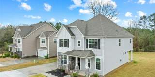 Rare 2023-built home on an oversized 0.35-acre lot in one of Waxhaw's most sought-after communities — zoned for the 9/10-rated Waxhaw Elementary School and move-in ready today. Gallery 9