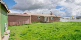 Spacious 3 Bed 2 Bath Brick Home with RV Parking, Shop Space & Large Yard in Tremonton! Gallery 43