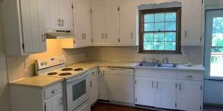 Updated 2 bedroom, 1 bath apartment with walk-out patio off of kitchen, and updated flooring. Gallery 2