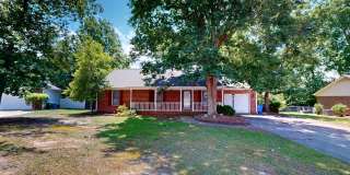 Charming 3 bedroom / 2 bathroom home with large fenced backyard near shopping & Fort Bragg! Gallery 1