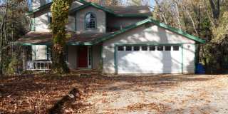 Forest Ranch Home for Rent | 2 Story Home with Large Deck, Garage & Wooded Setting Gallery 1