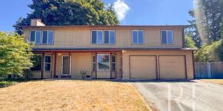 Cozy 4-Bedroom Home with Two Fireplaces, Fenced Backyard & 2-Car Garage Gallery 1
