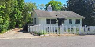 Cute white cottage with white picket fence & Huge deck off back door! Gallery 1