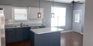 Rare home on the island! Large fenced in back yard! Pets are allowed. Owner will manage. Gallery 6