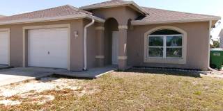 ONE MONTH FREE RENT!! SW Cape 3/2/1 Duplex Avail Now Gallery 1