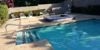 Very private, mostly furnished, rustic Maui Meadows home with large pool, walk around deck with panoramic ocean views. Available for 6 months only. Gallery 34
