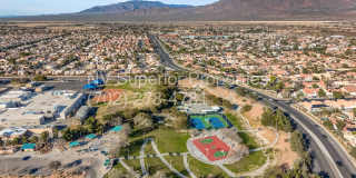 NW!! 4 Bedrooms!!! All Tile and Pergo flooring T/O!! NO Carpet!!! Low Maintenance Desert landscaping front and back!! With Patio cover in back!!! Gallery 57