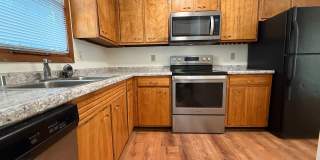August 15th rent special! New deck! 3 Bedroom, updated kitchen, updated flooring, garage, driveway, and fenced yard - 9 month lease available! Gallery 5