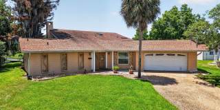 Available Now! Unique Canal-Front Pool Home with Boathouse & Chain of Lakes Access Gallery 1