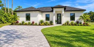 Brand-New Pool Home with a Legal Mother-in-Law Suite in Lehigh Acres FL! Brand-New Pool Home with a Legal Mother-in-Law Suite in Lehigh Acres FL! Gallery 1