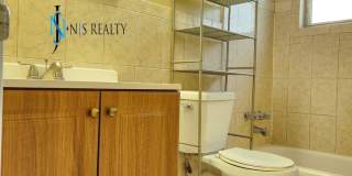 Beautiful 2/2/1 1150 Sq. Ft. with BONUS ROOM!!... tile & luxury plank flooring, Frest paint and a large fenced in yard! Gallery 15