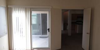 Huge family room with kitchen nicely tucked in the middle. Gallery 17