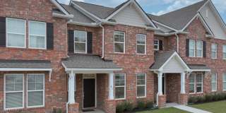 **BE THE LUCKY ONE TO LIVE IN THIS 2024-BUILT BRICK TOWNHOME IN THE VILLAS AT REGAL SQUARE FEATURING A 2-CAR GARAGE WITH EPOXY FLOOR AND PRIVATE COURTYARD** Gallery 1
